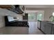Modern kitchen with gray cabinets, quartz countertops, and stainless steel appliances at 1071 Cherry Stem Rd, Haw River, NC 27258