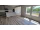 Open concept kitchen with island, gray cabinets, and vinyl flooring at 1071 Cherry Stem Rd, Haw River, NC 27258