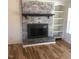Whitewashed brick fireplace with built-in shelving at 876 Vanco Mill Rd, Henderson, NC 27537
