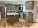 Modern kitchen with stainless steel appliances and large island at 876 Vanco Mill Rd, Henderson, NC 27537