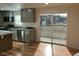 Modern kitchen with stainless steel appliances and sliding glass door at 876 Vanco Mill Rd, Henderson, NC 27537