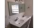 Bathroom with double vanity, large mirror, and shower at 876 Vanco Mill Rd, Henderson, NC 27537