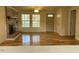 Living room with hardwood floors and brick fireplace at 876 Vanco Mill Rd, Henderson, NC 27537