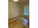 Bright bedroom with hardwood floors and ceiling fan at 876 Vanco Mill Rd, Henderson, NC 27537