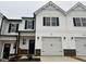 Charming two-story home with white siding, black shutters, and attached garage at 132 S Mistflower St, Clayton, NC 27520