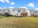 Spacious backyard with screened porch and grassy area at 149 Curling Creek Dr, Clayton, NC 27527