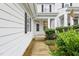 Townhouse with a walkway, landscaping, and a white exterior at 661 Boone Station Dr # 4, Burlington, NC 27215