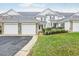 Townhouse with two-car garage, landscaping, and a charming front porch at 661 Boone Station Dr # 4, Burlington, NC 27215