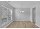 Spacious dining area with hardwood floors and large window at 142 Brentfield Loop, Morrisville, NC 27560