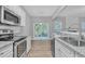Kitchen boasts granite countertops and stainless steel appliances at 142 Brentfield Loop, Morrisville, NC 27560