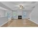 Open living room with hardwood floors and fireplace at 142 Brentfield Loop, Morrisville, NC 27560