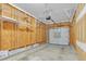 Unfinished garage with overhead door and shelving at 142 Brentfield Loop, Morrisville, NC 27560