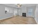 Living room with hardwood floors, fireplace and kitchen views at 142 Brentfield Loop, Morrisville, NC 27560