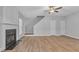 Living room with hardwood floors, fireplace and built-in shelving at 142 Brentfield Loop, Morrisville, NC 27560