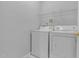 Laundry room with washer, dryer, and overhead shelving at 142 Brentfield Loop, Morrisville, NC 27560