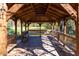 Wooden gazebo offering scenic pond views at 142 Brentfield Loop, Morrisville, NC 27560