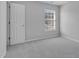 Bright bedroom with carpeted floor and a window with blinds at 142 Brentfield Loop, Morrisville, NC 27560