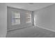 Spacious bedroom with two windows, carpet, and ceiling fan at 142 Brentfield Loop, Morrisville, NC 27560