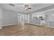 Bright living room with hardwood floors, fireplace, and ceiling fan at 142 Brentfield Loop, Morrisville, NC 27560