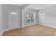 Bright dining room with wood floors and chandelier at 142 Brentfield Loop, Morrisville, NC 27560