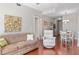 Spacious living room with hardwood floors, a sofa, and a dining area at 222 Glenwood # 602, Raleigh, NC 27603