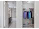 Bathroom with tub and double sink vanity; adjacent walk-in closet at 222 Glenwood # 602, Raleigh, NC 27603