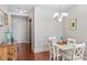 Bright dining area with hardwood floors and white table at 222 Glenwood # 602, Raleigh, NC 27603