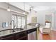 Open concept kitchen with stainless steel appliances and granite countertops at 222 Glenwood # 602, Raleigh, NC 27603