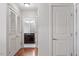Hallway with hardwood floors, linen closet, and bathroom access at 222 Glenwood # 602, Raleigh, NC 27603