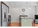 Modern kitchen with stainless steel appliances and granite island at 222 Glenwood # 602, Raleigh, NC 27603