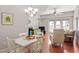 Bright dining area with hardwood floors and white table at 222 Glenwood # 602, Raleigh, NC 27603