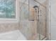 Walk-in shower with glass enclosure and tile surround at 2036 Tradition Dr, Burlington, NC 27215