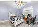 Bright bedroom with a double bed, desk, and window at 2036 Tradition Dr, Burlington, NC 27215