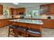 Updated kitchen with an island, granite countertops, and stainless steel appliances at 178 Paceville Rd, Selma, NC 27576