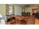 Bright dining area with wood table and chairs, hardwood floors at 178 Paceville Rd, Selma, NC 27576