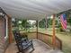 Spacious front porch with rocking chairs offering a view of the street at 178 Paceville Rd, Selma, NC 27576