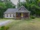 Brick house with a front porch and nicely landscaped yard at 178 Paceville Rd, Selma, NC 27576