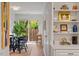 Charming dining area with glass table, black chairs, and access to backyard at 3738 Yorktown Pl, Raleigh, NC 27609