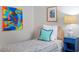 Bedroom featuring a twin bed, nightstand, and colorful art at 3738 Yorktown Pl, Raleigh, NC 27609