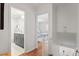 Hallway view of bathroom and bedroom with hardwood floors at 3738 Yorktown Pl, Raleigh, NC 27609
