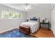 Charming bedroom with a queen-size bed and blue rug at 3738 Yorktown Pl, Raleigh, NC 27609