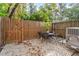 Private patio with bistro set and wood fence at 3738 Yorktown Pl, Raleigh, NC 27609