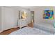 Bedroom with twin beds, dresser, and access to hallway at 3738 Yorktown Pl, Raleigh, NC 27609