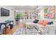 Bright living room with sectional sofa, built-in shelving, and hardwood floors at 3738 Yorktown Pl, Raleigh, NC 27609