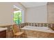 Bathroom with a large soaking tub and tile accents at 415 River Bluff Dr, Dunn, NC 28334