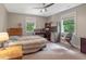 Bedroom with a built-in desk and wood floors at 415 River Bluff Dr, Dunn, NC 28334