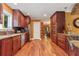 Large kitchen with hardwood floors and cherry cabinets at 415 River Bluff Dr, Dunn, NC 28334