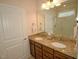 Elegant bathroom with double sinks, granite countertops, and a large walk-in shower at 528 Turnstone Dr, Durham, NC 27703