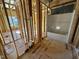 Bathroom with shower and tub, framing stage at 595 Husketh Rd, Youngsville, NC 27596