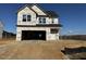 Two-story house with a two-car garage and vinyl siding at 595 Husketh Rd, Youngsville, NC 27596